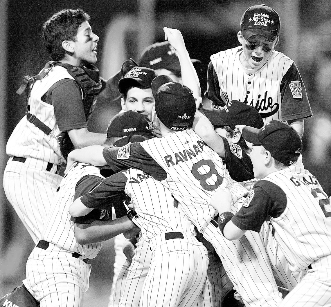 Westside Little League All-Stars celebrating on the mound, 2002